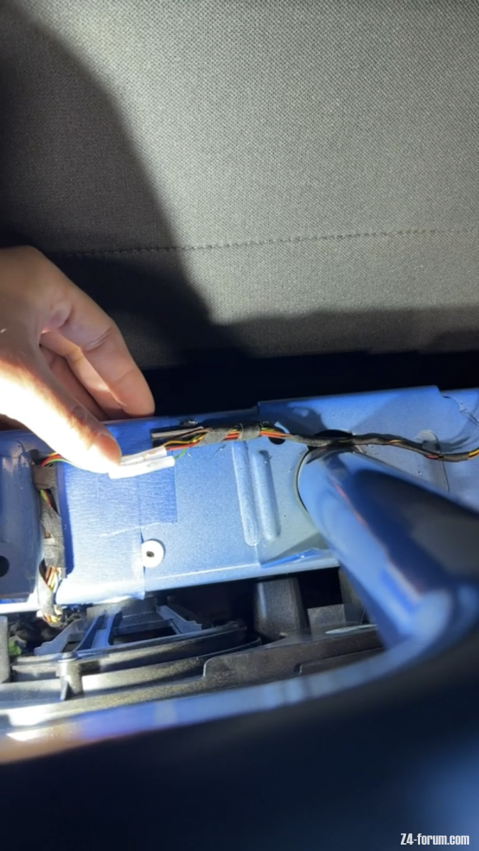Wire repair behind passenger seat